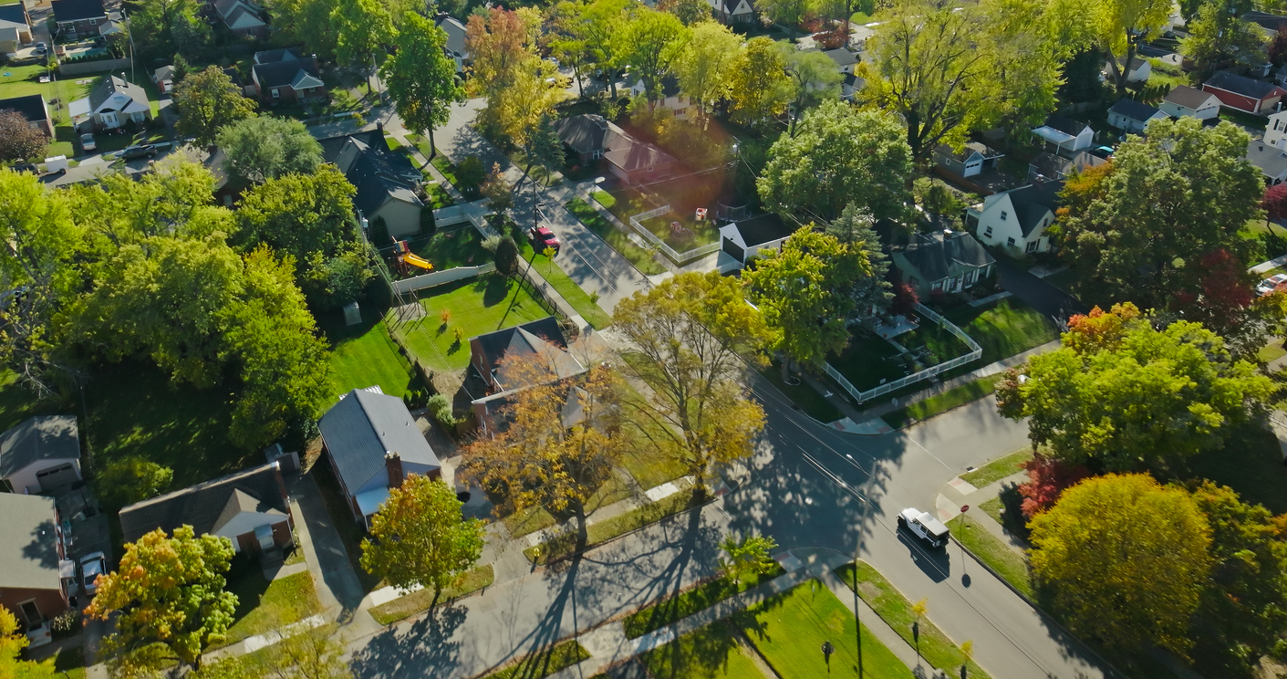 Aerial still of residential neighborhood in Oakwood, a small city in Montgomery County, Ohio, on a clear day in the Fall.