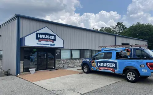 Hauser Heating & Air Conditioning office with a branded HVAC service truck parked outside in Cincinnati, Ohio.